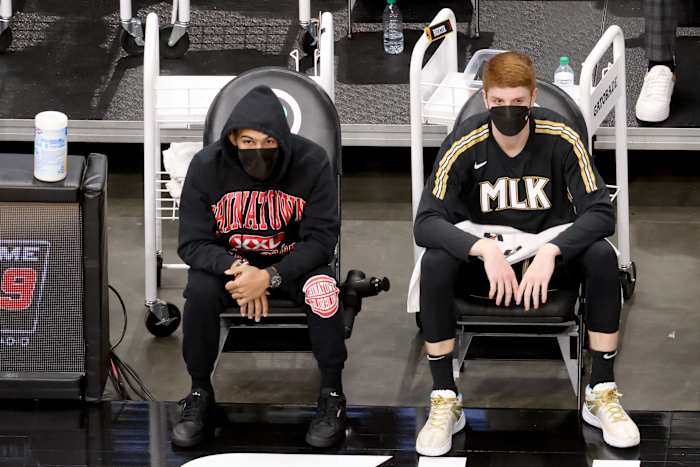 Atlanta Hawks guard Trae Young (left) and guard Kevin Huerter sit on the bench during the second quarter against the Miami Heat at State Farm Arena.
